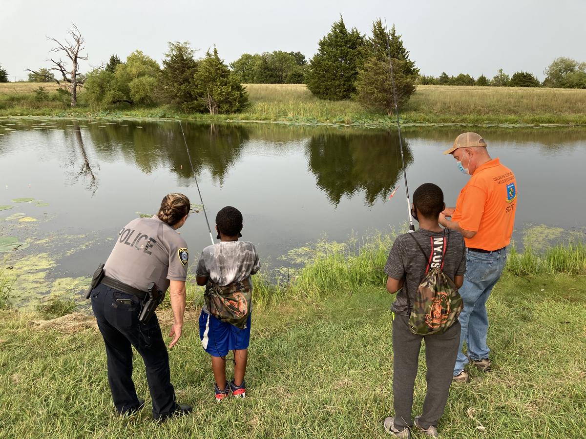 OKC foster children and volunteers enjoy a day of fishing at South Lakes Park.