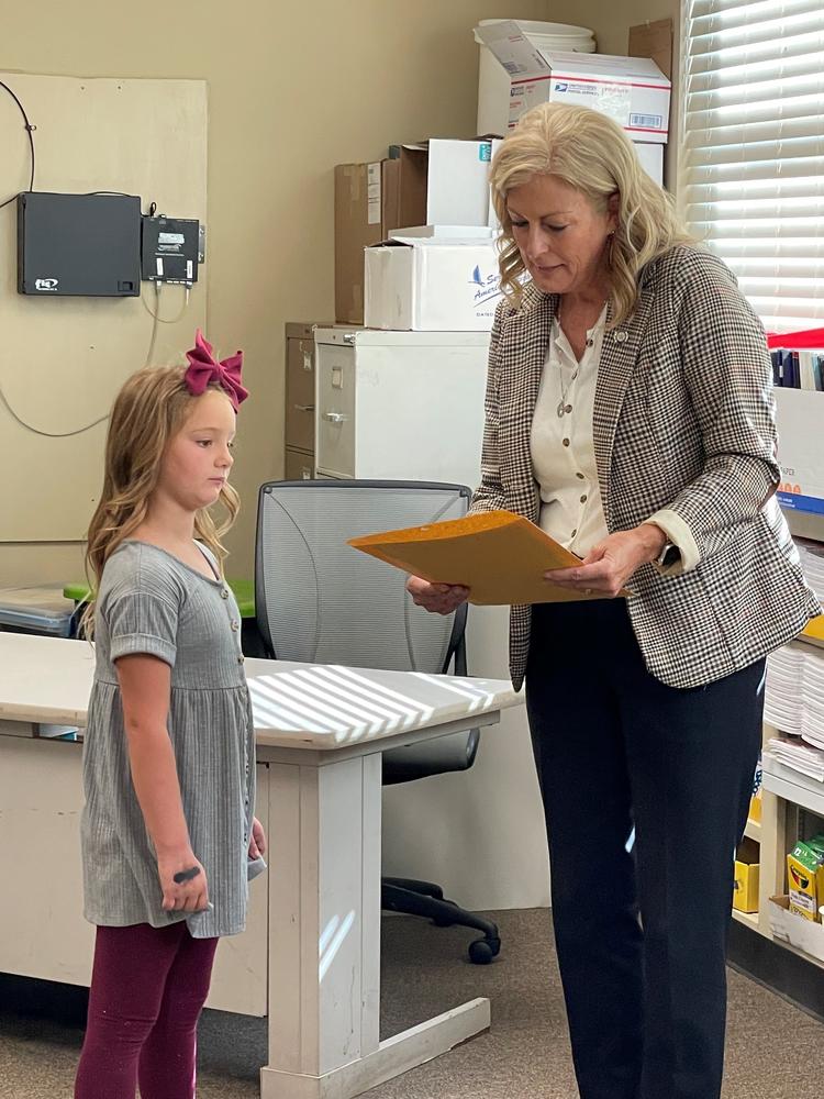 Sen. Kim David, R-Porter, reads the legislative citation to 1st grader Hadley Roberson at Norwood Schools Tuesday.