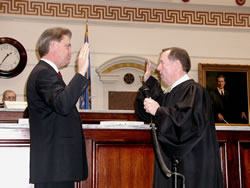 Senator Laster sworn in by Chief Justice Joseph Watt.