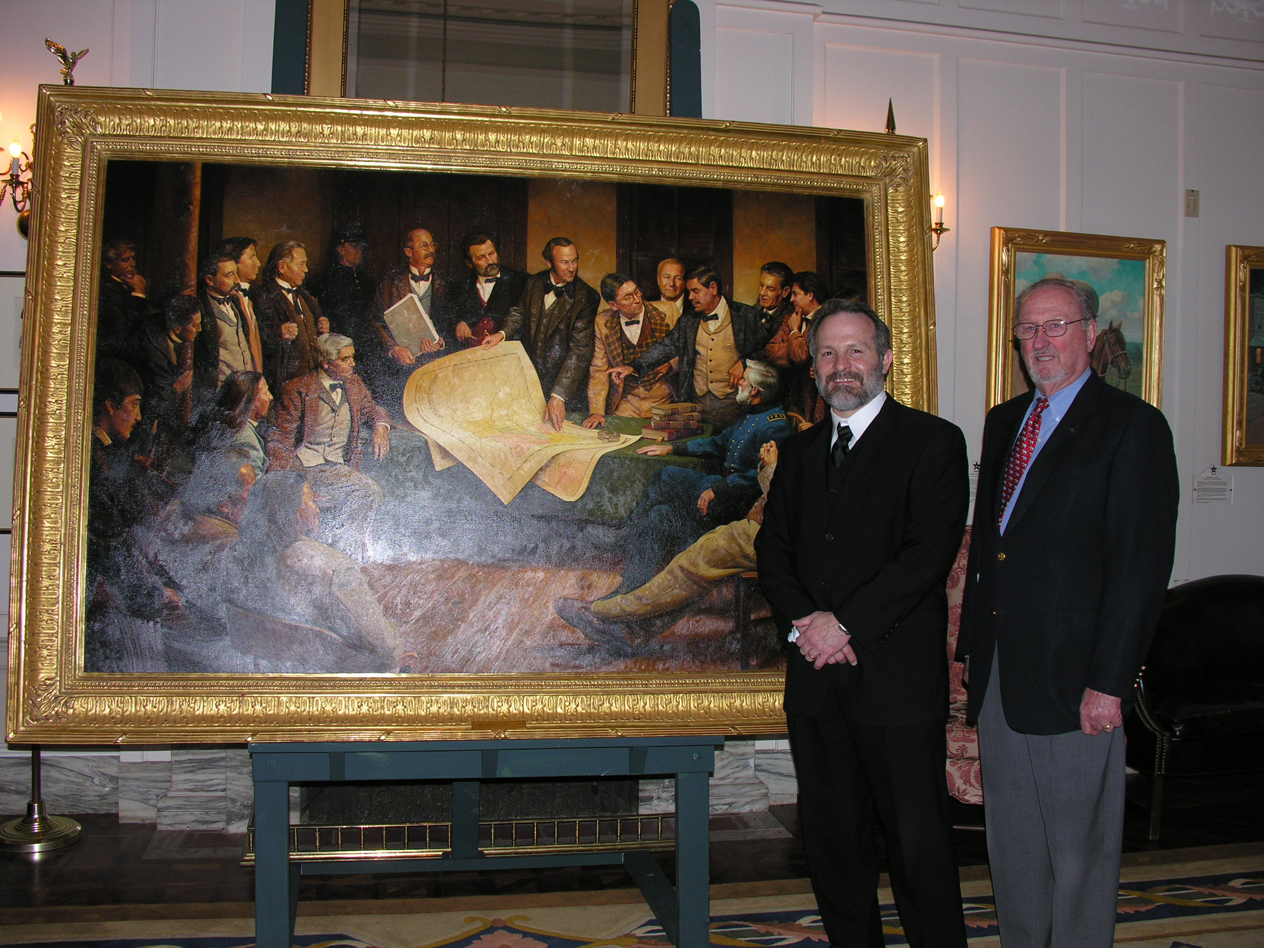 Artist Mike Wimmer and Charles Ford, President of the Oklahoma State Senate Historical Preservation Fund, unveiled "Fort Smith Council 1865" at the Capitol.