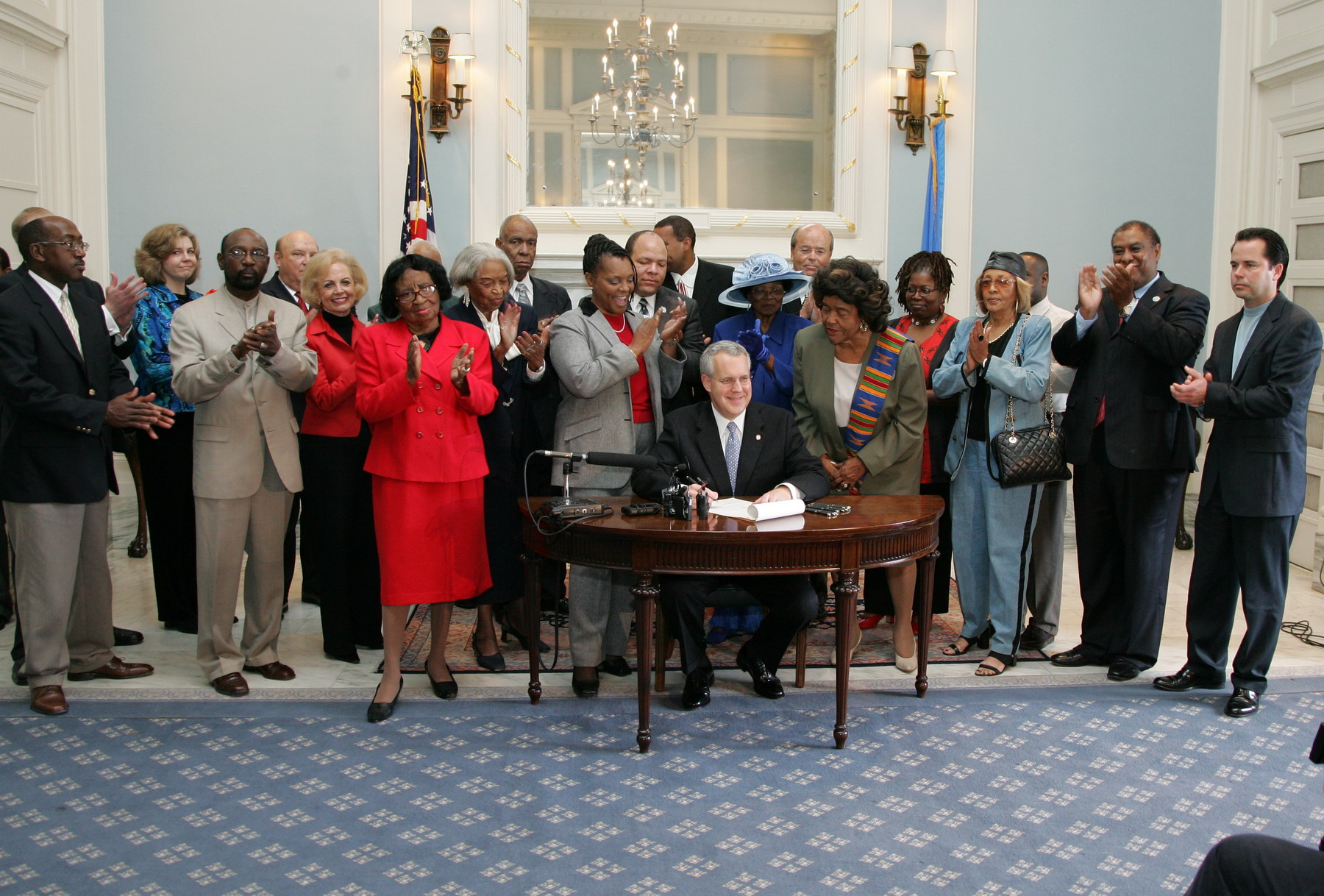Governor Henry ceremoniously signs Senate Bill 1919 to create the African-American Centennial Plaza..