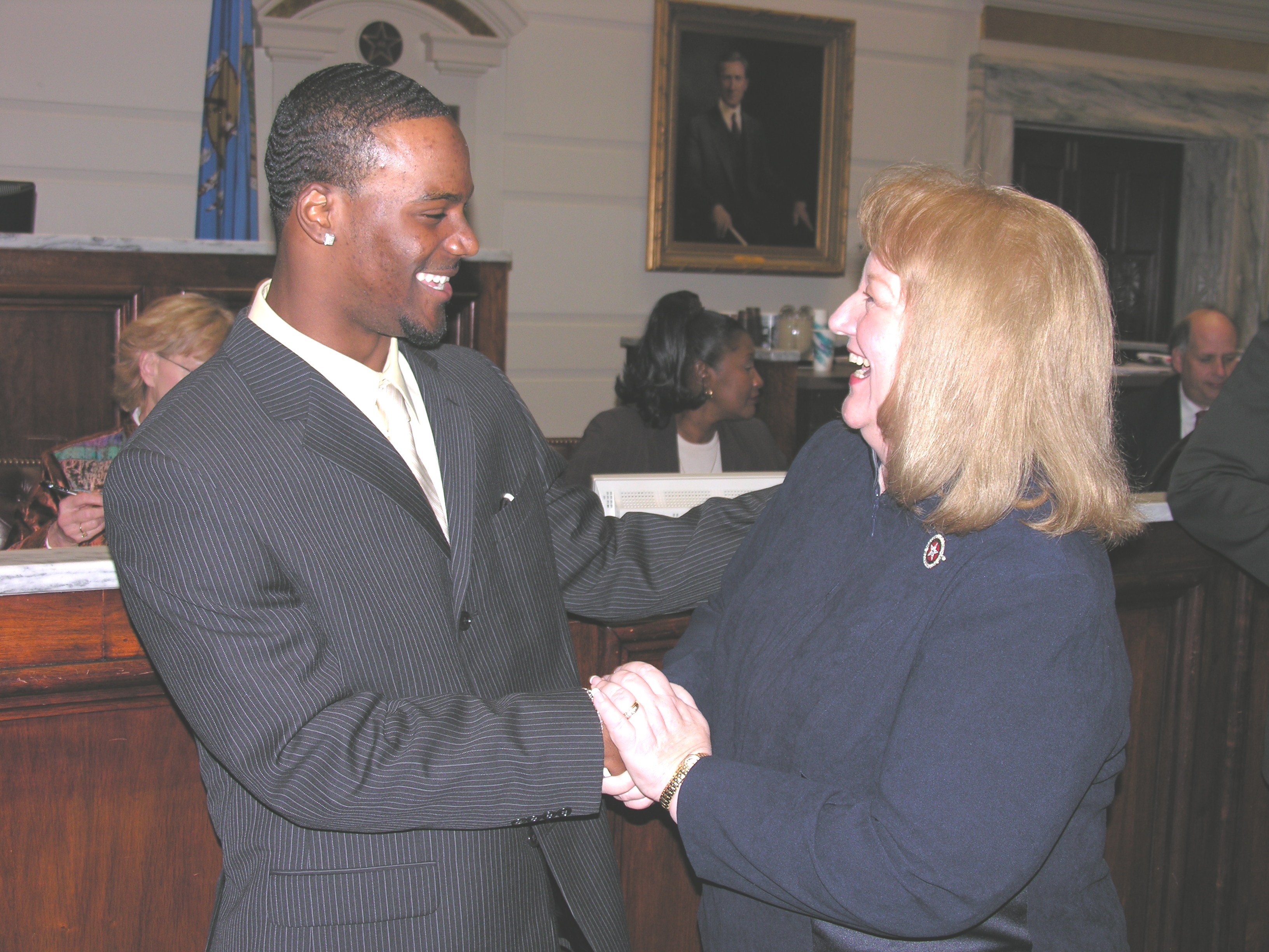 Senator Debbe Leftwich congratulates Aaron Ross on the Senate floor.