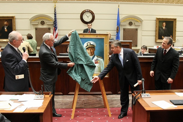 Admiral Hull and Sen. Cliff Branan unveil Admiral Clark's portrait in the Senate Chamber.