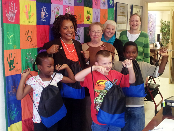 Students at Positive Tomorrows School were excited to receive sackpacks Tuesday, provided by the Office Depot Foundation and the National Foundation for Women Legislators, full of snacks and  school supplies donated by Sen. Constance Johnson and other St