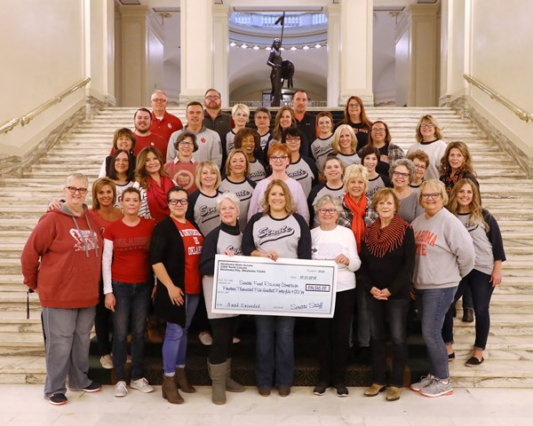 Senate staff celebrates their fundraising record for the State Charitable Campaign  and Regional Food Bank of Oklahoma.